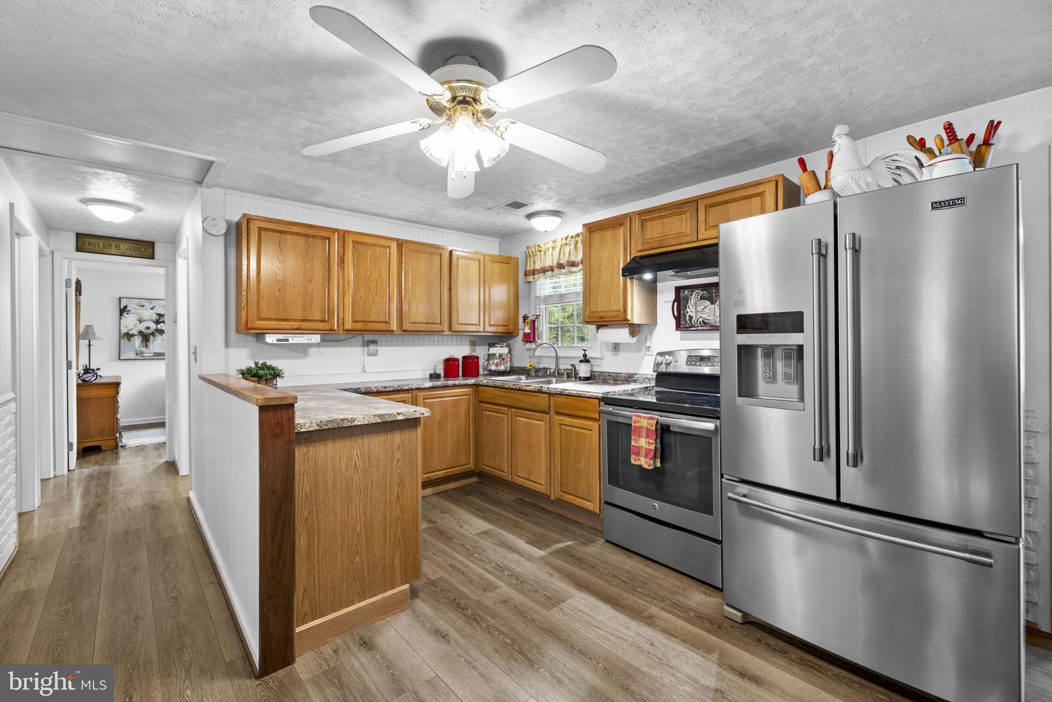 171 Triple J Road Berryville, VA 22611 - Photo 20 of 95 Roomy peninsula mades for ample counter space.