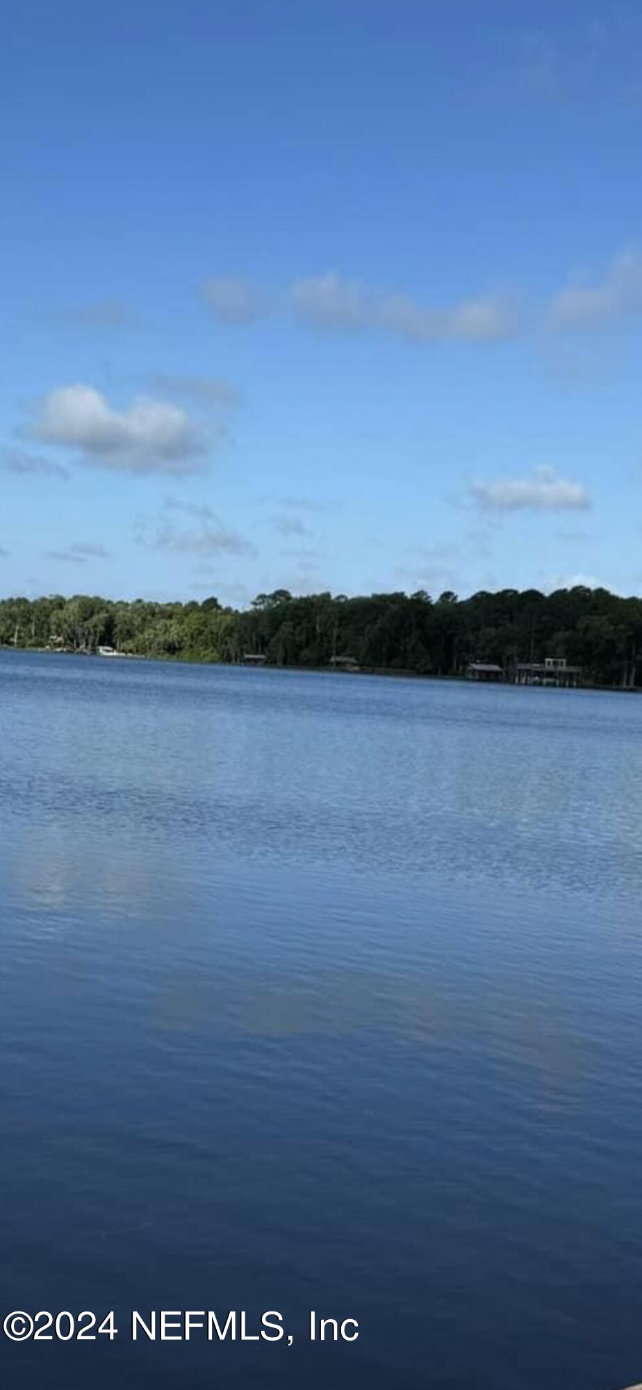 a view of outside space and a lake view