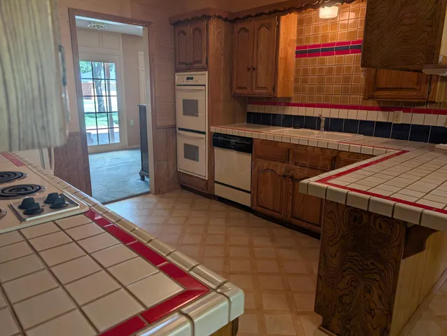 a kitchen with a sink and cabinets