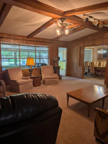 a living room filled with furniture and a fireplace