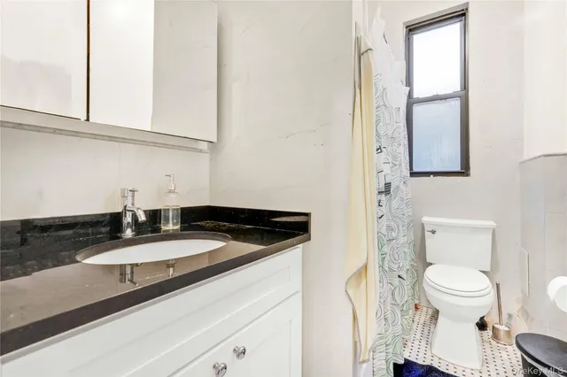 a close view of a sink and a toilet