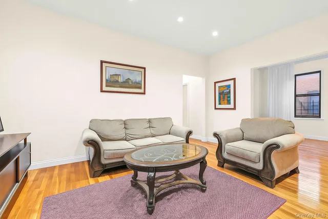 a living room with furniture and a rug