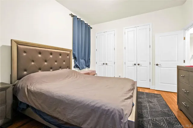 a large bed sitting in a bedroom and closet