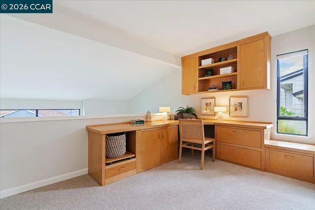 a utility room with cabinets dryer and washer