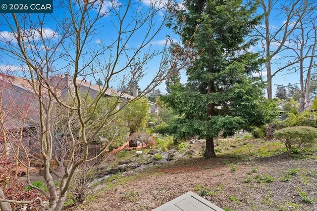 a backyard of a house with lots of green space