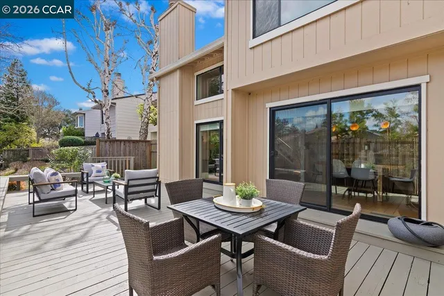 a view of a patio with a dining table and chairs
