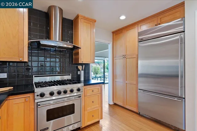 a kitchen with appliances and cabinets