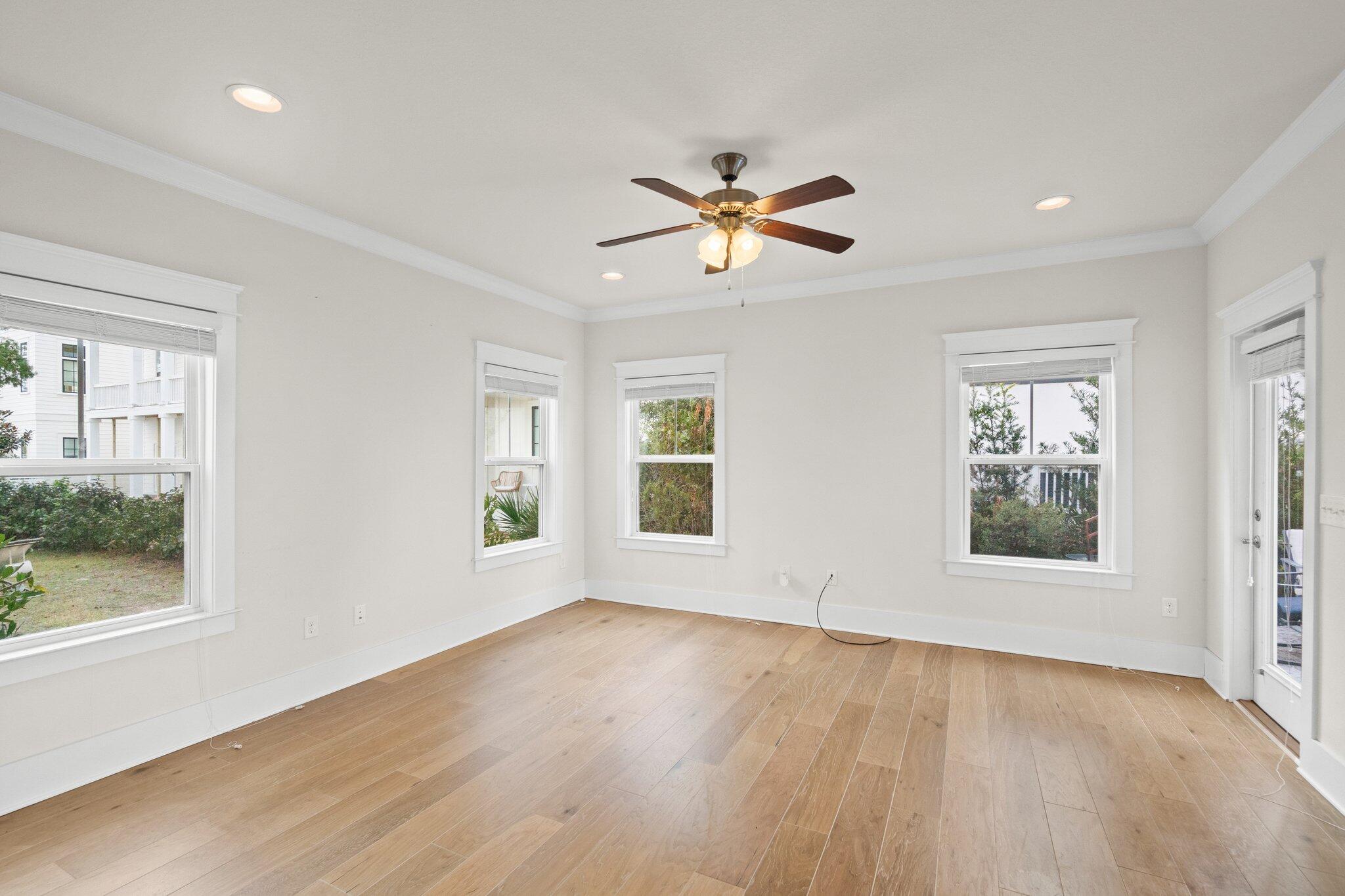 89 Grande Pointe Drive Inlet Beach, FL 32461 - Photo 14 of 47 a view of empty room with wooden floor and fan