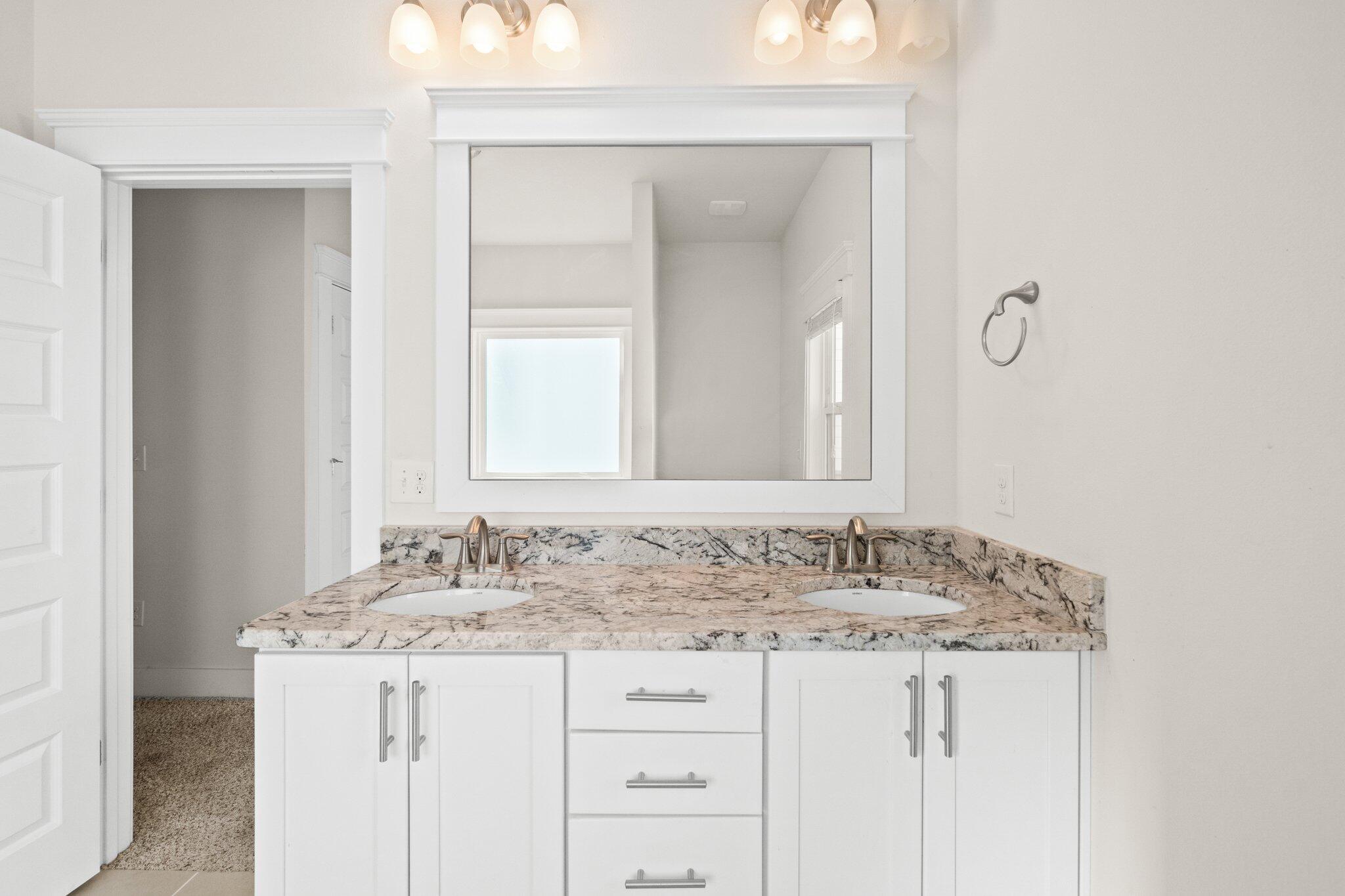 89 Grande Pointe Drive Inlet Beach, FL 32461 - Photo 27 of 47 a bathroom with a granite countertop sink and a mirror