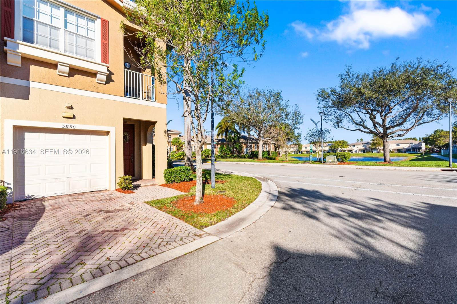 5850 Hampton Hills Boulevard, Unit 5850 Tamarac, FL 33321 - Photo 13 of 22 a view of a house with a yard