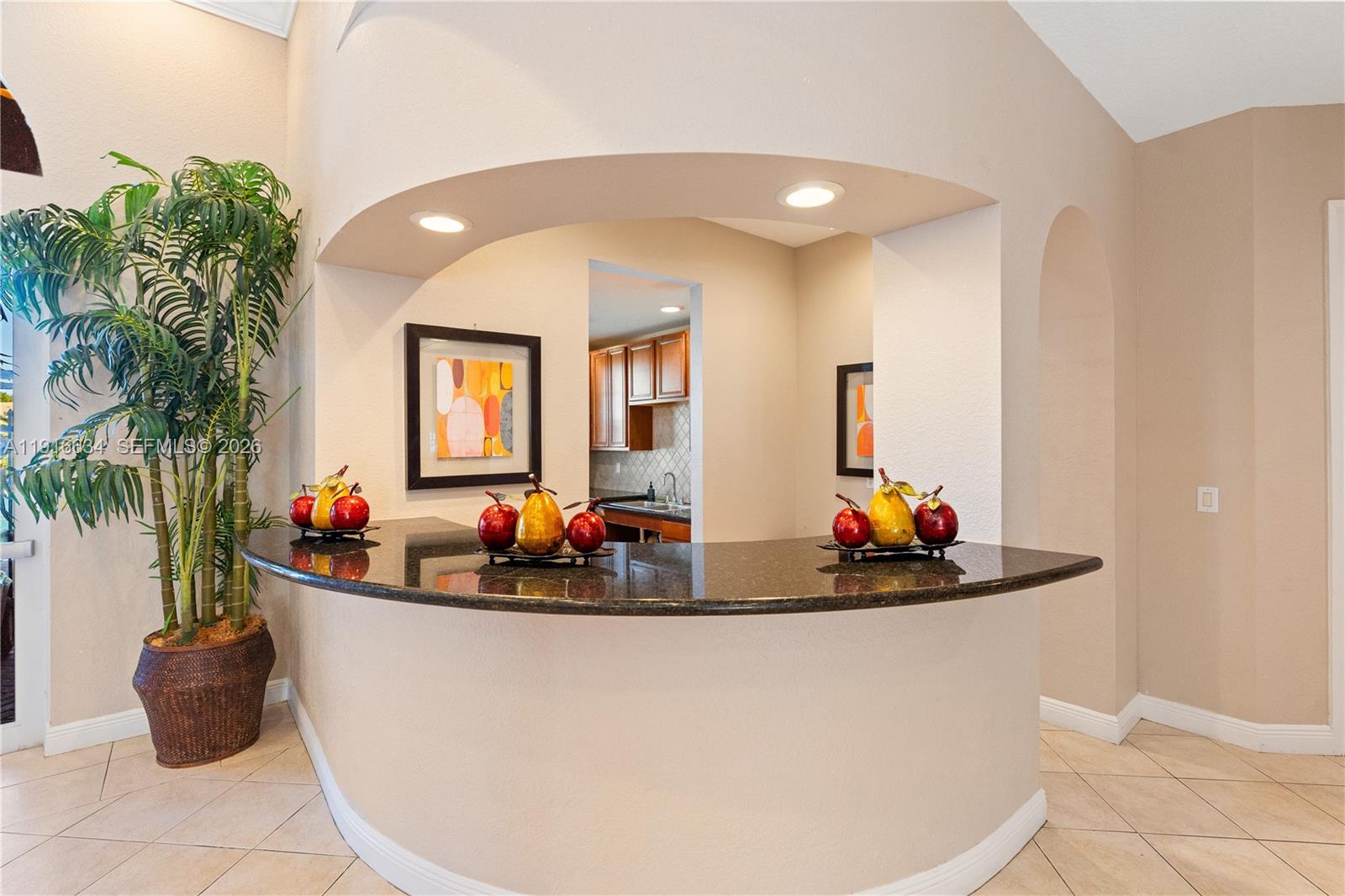 5850 Hampton Hills Boulevard, Unit 5850 Tamarac, FL 33321 - Photo 19 of 22 a view of a living room with furniture and potted plants