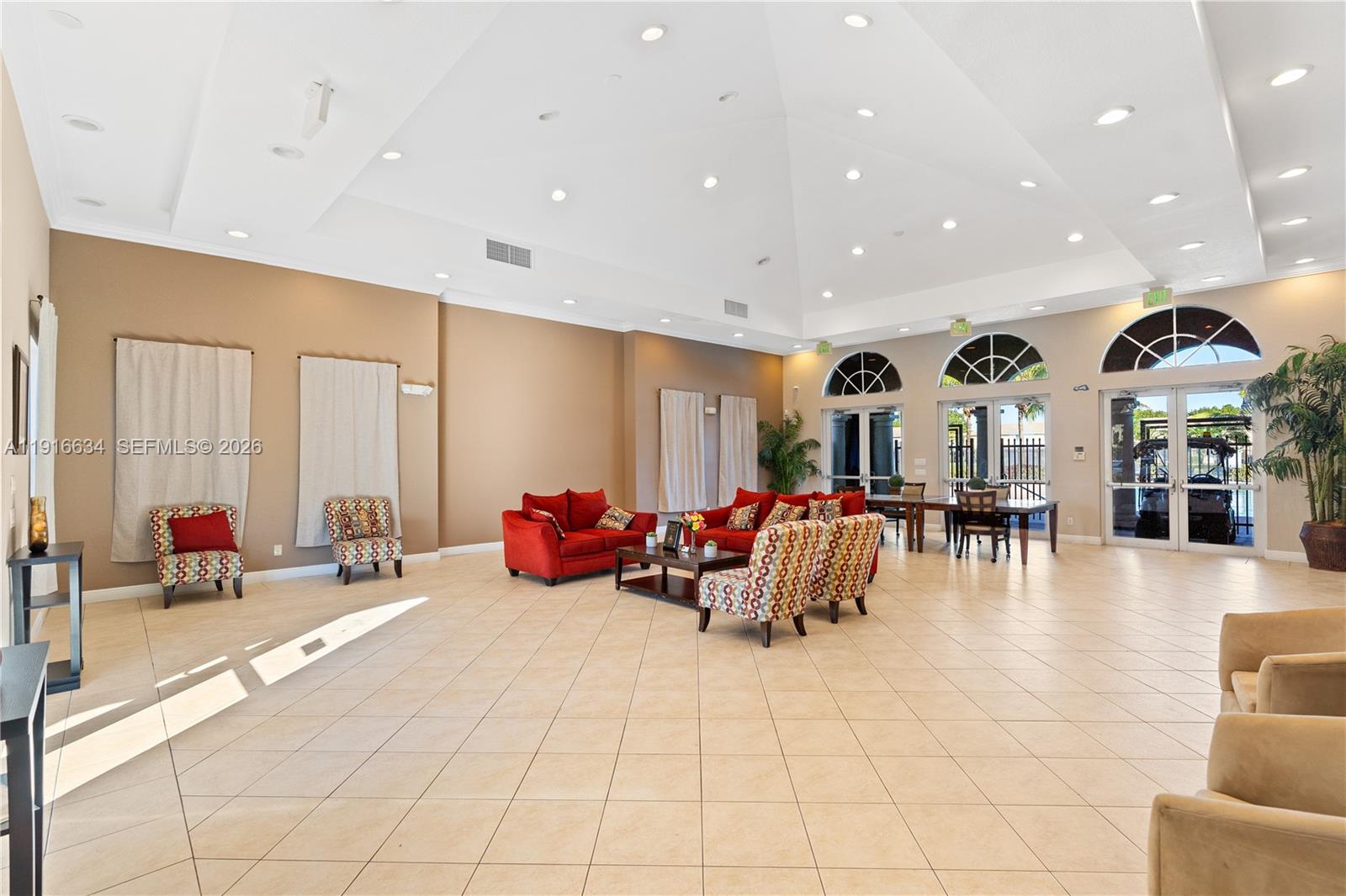 5850 Hampton Hills Boulevard, Unit 5850 Tamarac, FL 33321 - Photo 20 of 22 a living room with furniture and a large window