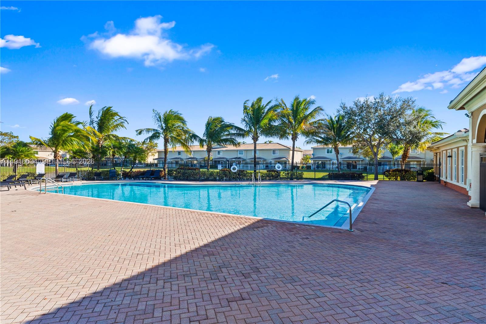 5850 Hampton Hills Boulevard, Unit 5850 Tamarac, FL 33321 - Photo 21 of 22 a view of swimming pool with outdoor seating and yard in back