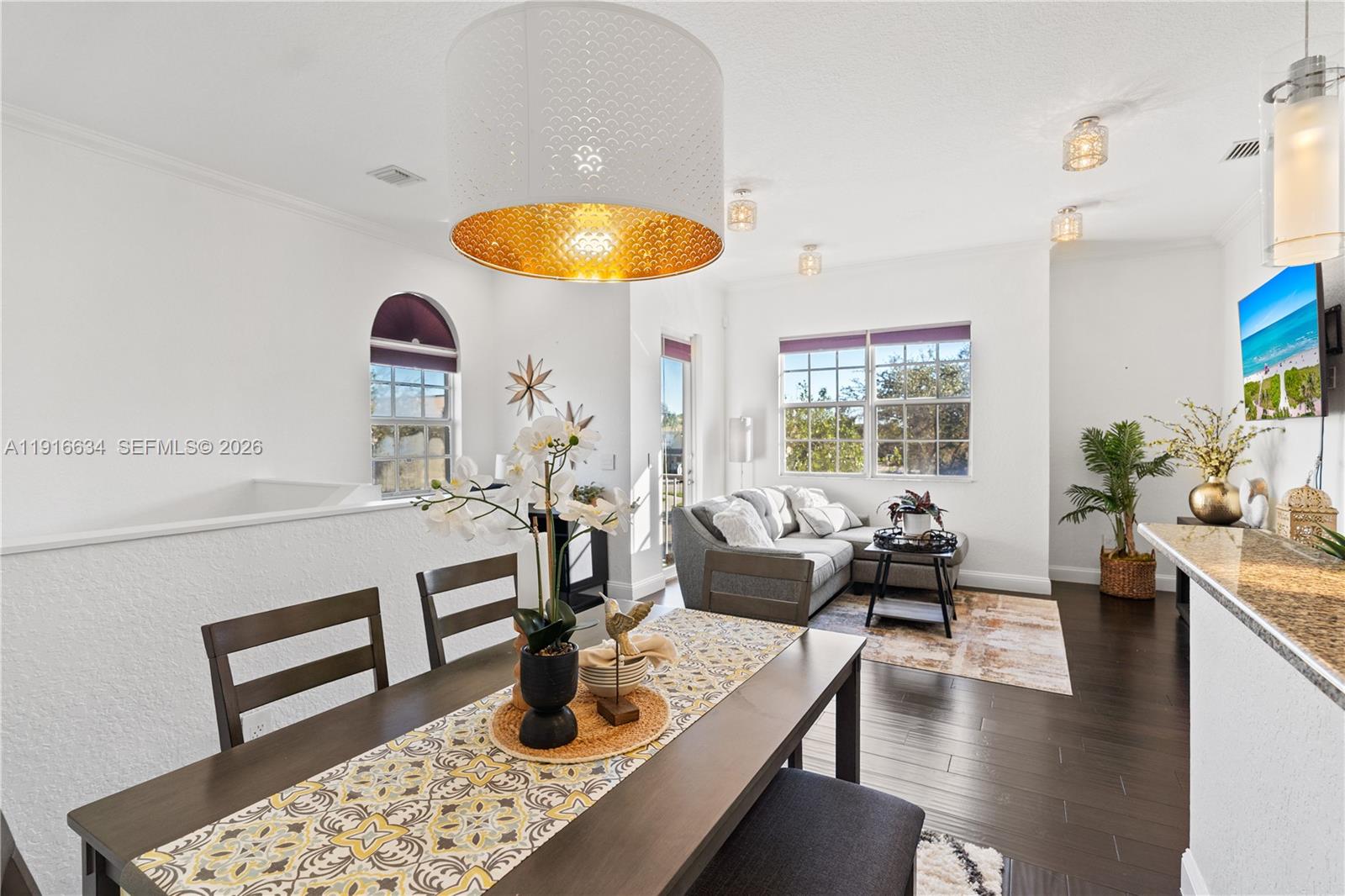 5850 Hampton Hills Boulevard, Unit 5850 Tamarac, FL 33321 - Photo 6 of 22 a living room with furniture and a large window
