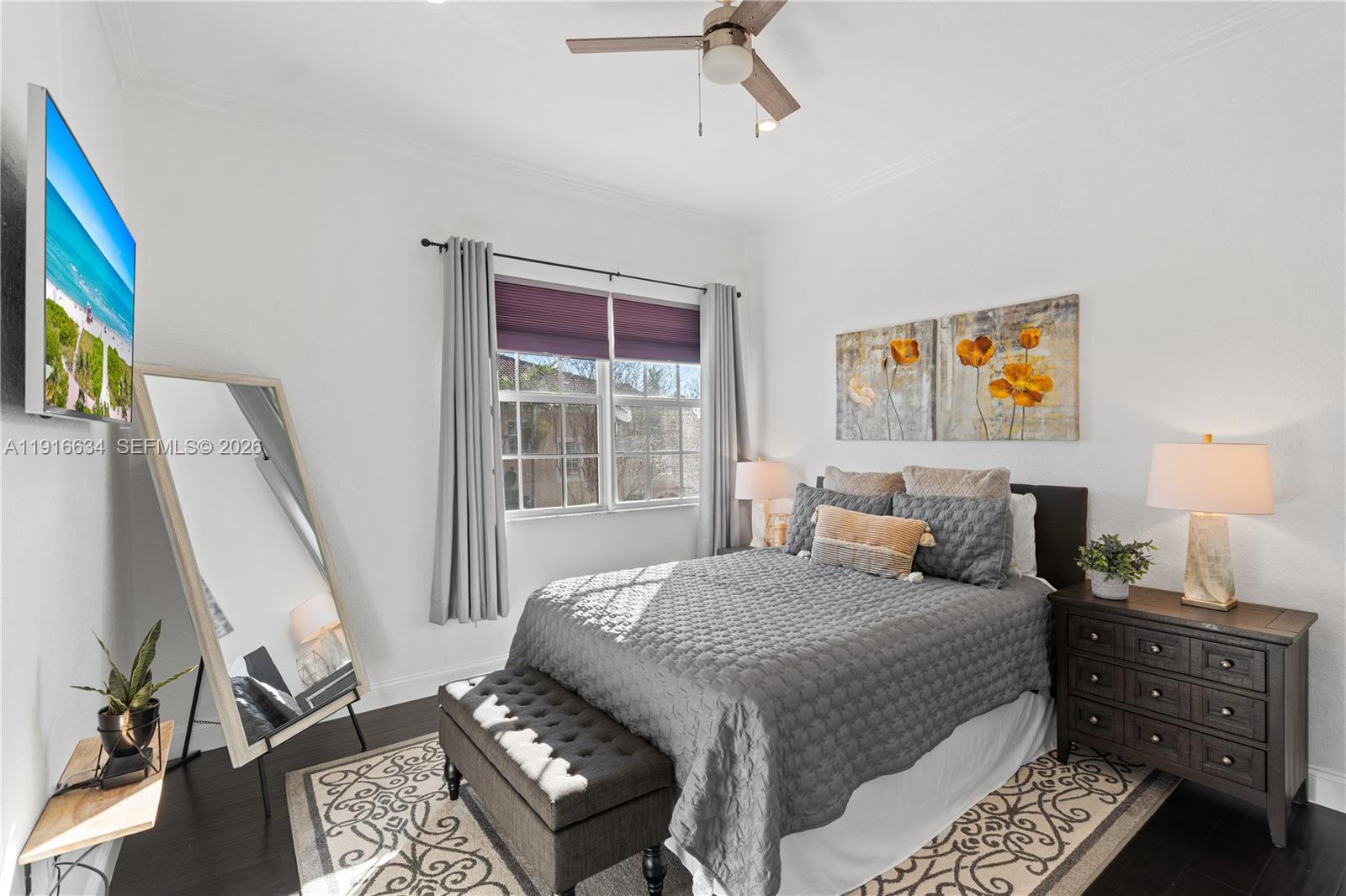 5850 Hampton Hills Boulevard, Unit 5850 Tamarac, FL 33321 - Photo 7 of 22 a bedroom with a bed and a window