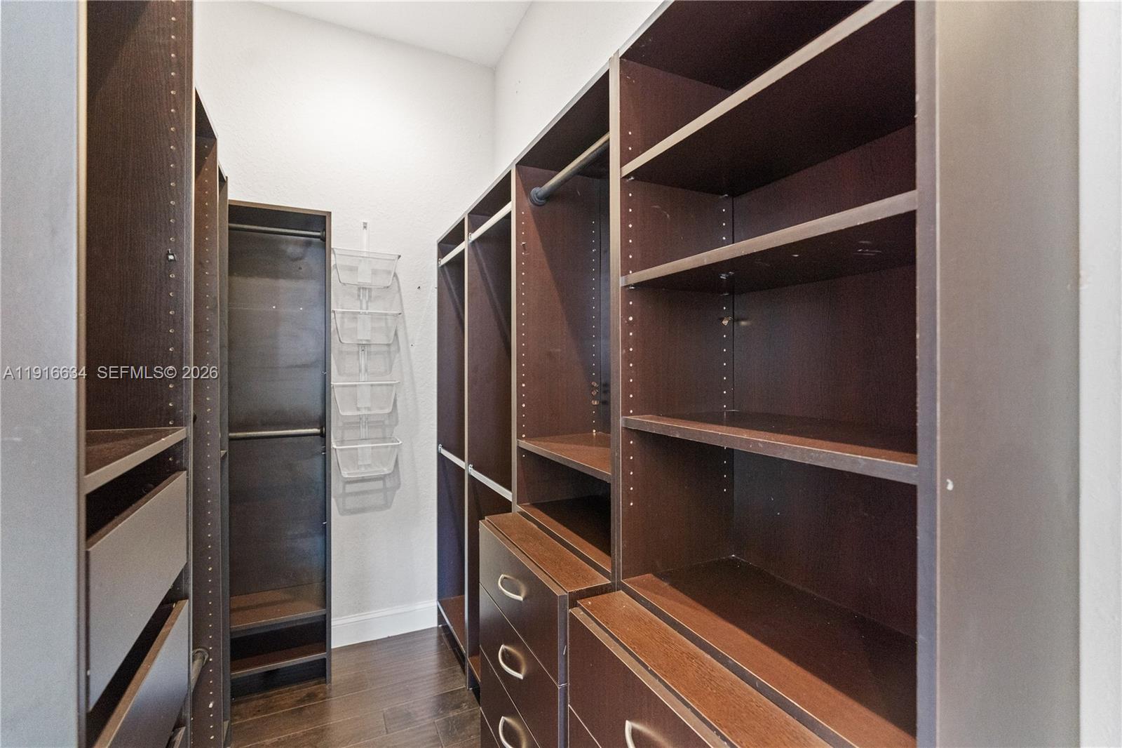 5850 Hampton Hills Boulevard, Unit 5850 Tamarac, FL 33321 - Photo 8 of 22 a room with rack on the wall