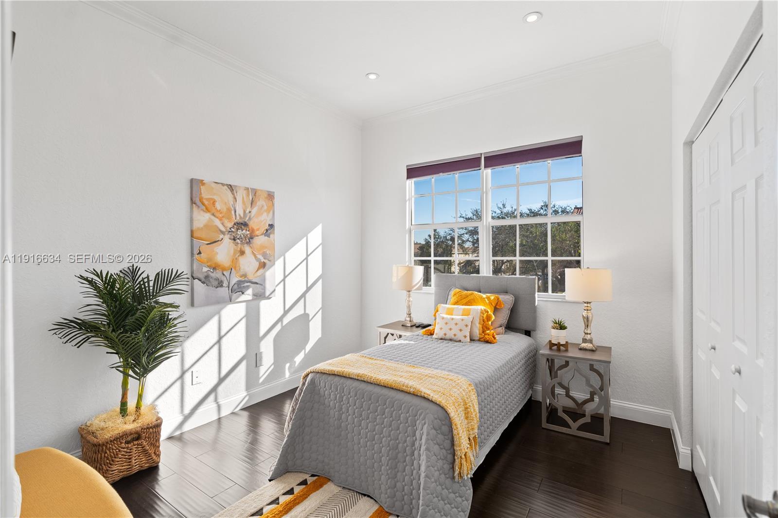 5850 Hampton Hills Boulevard, Unit 5850 Tamarac, FL 33321 - Photo 10 of 22 a bedroom with bed and window