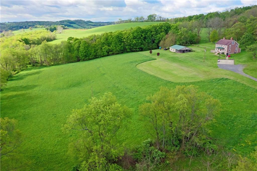 181 Rea Road Avella, PA 15312 - Photo 1 of 22 a backyard of a house with a yard and outdoor seating