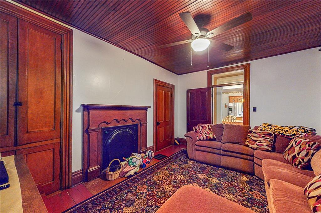 181 Rea Road Avella, PA 15312 - Photo 11 of 22 a living room with furniture ceiling fan and a window