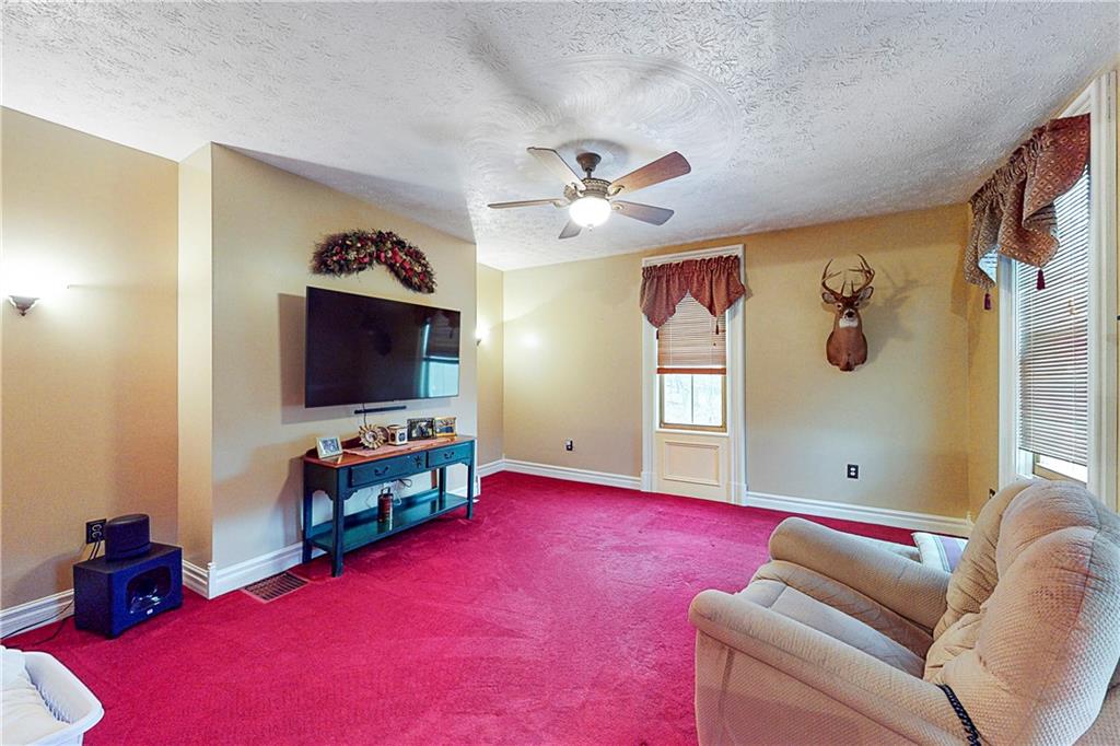 181 Rea Road Avella, PA 15312 - Photo 12 of 22 a living room with furniture and a flat screen tv