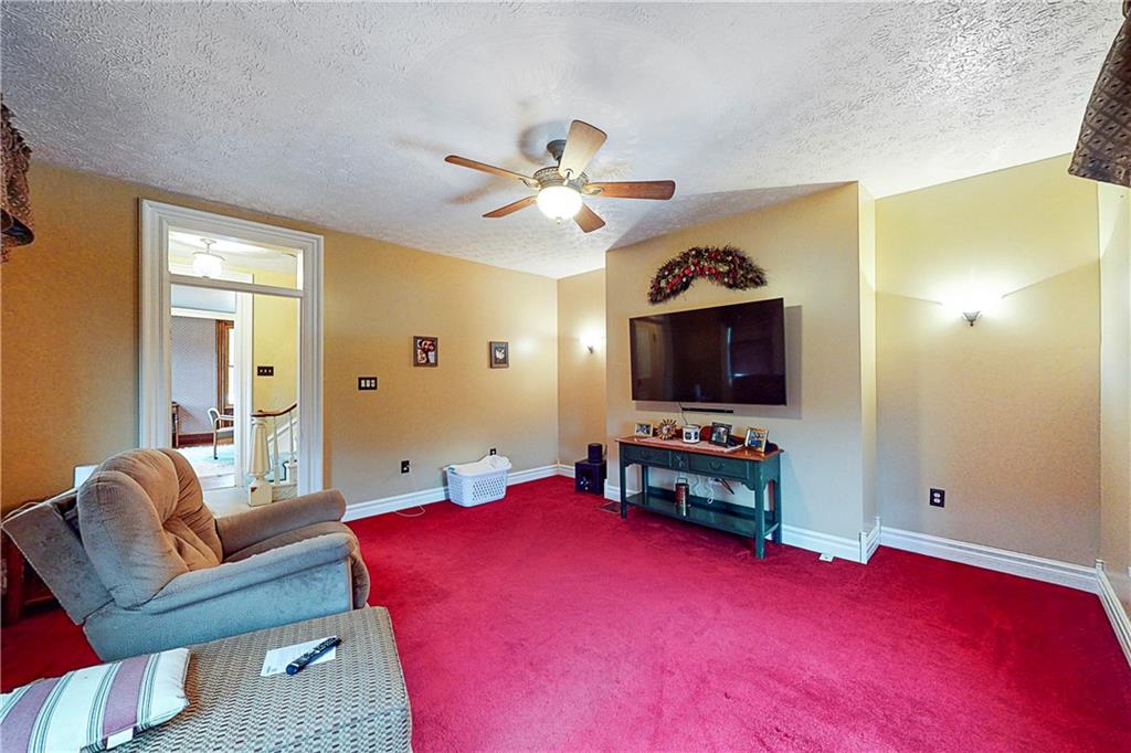 181 Rea Road Avella, PA 15312 - Photo 13 of 22 a living room with furniture and a flat screen tv