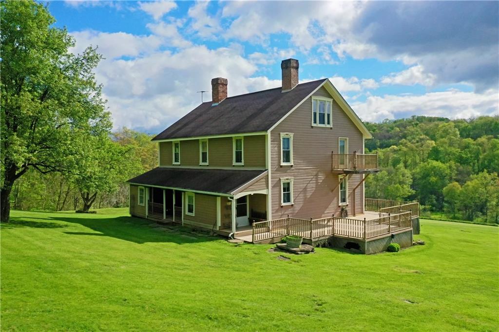 181 Rea Road Avella, PA 15312 - Photo 5 of 22 a front view of a house with a garden