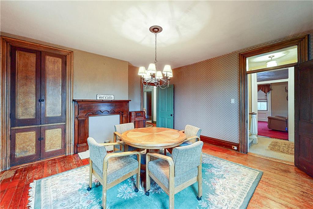 181 Rea Road Avella, PA 15312 - Photo 10 of 22 a dining room with furniture a chandelier and wooden floor