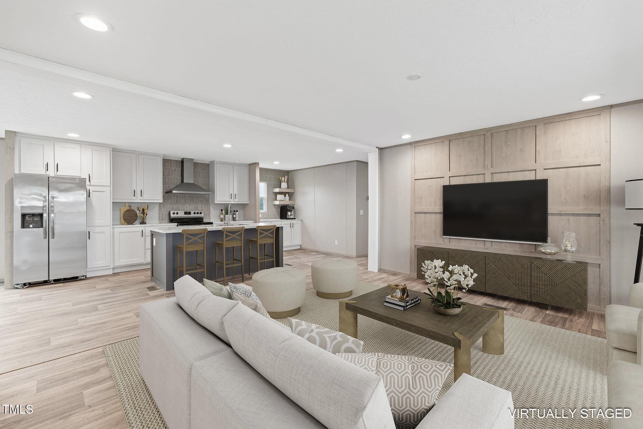 17 Stardust Lane Selma, NC 27576 - Photo 11 of 27 a living room with furniture and a flat screen tv