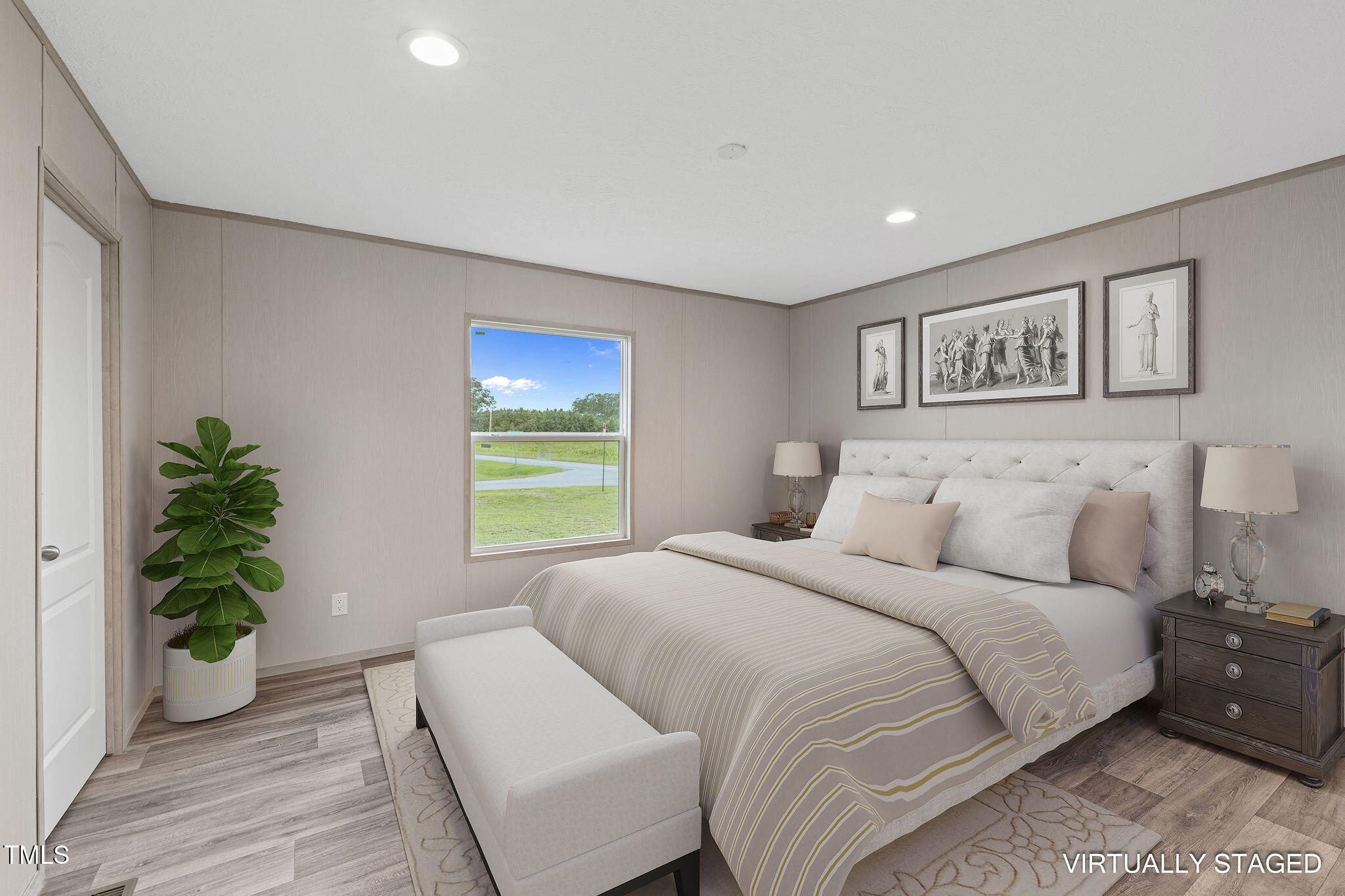 17 Stardust Lane Selma, NC 27576 - Photo 20 of 27 a bedroom with a large bed and a potted plant