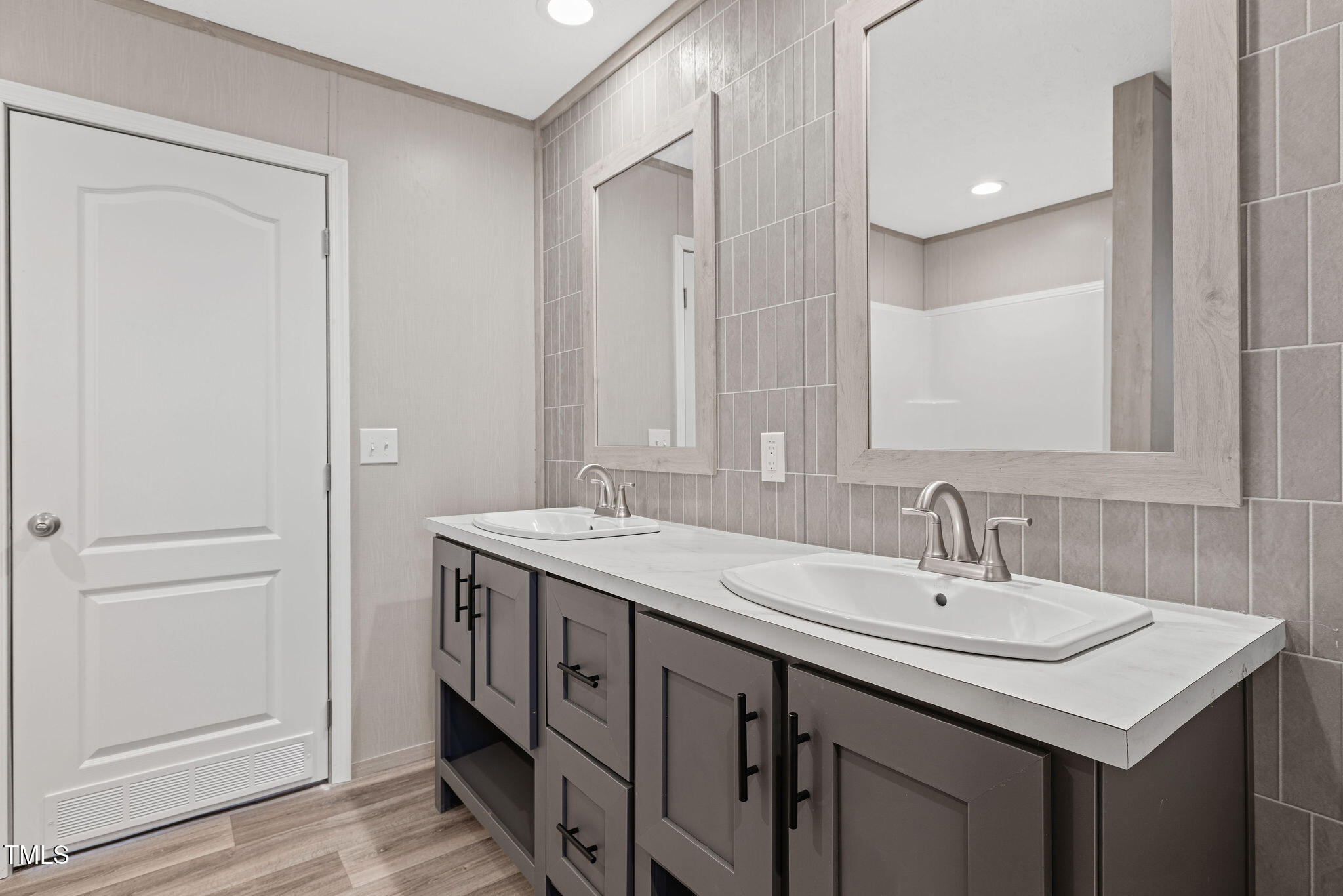 17 Stardust Lane Selma, NC 27576 - Photo 22 of 27 a bathroom with a sink and a mirror