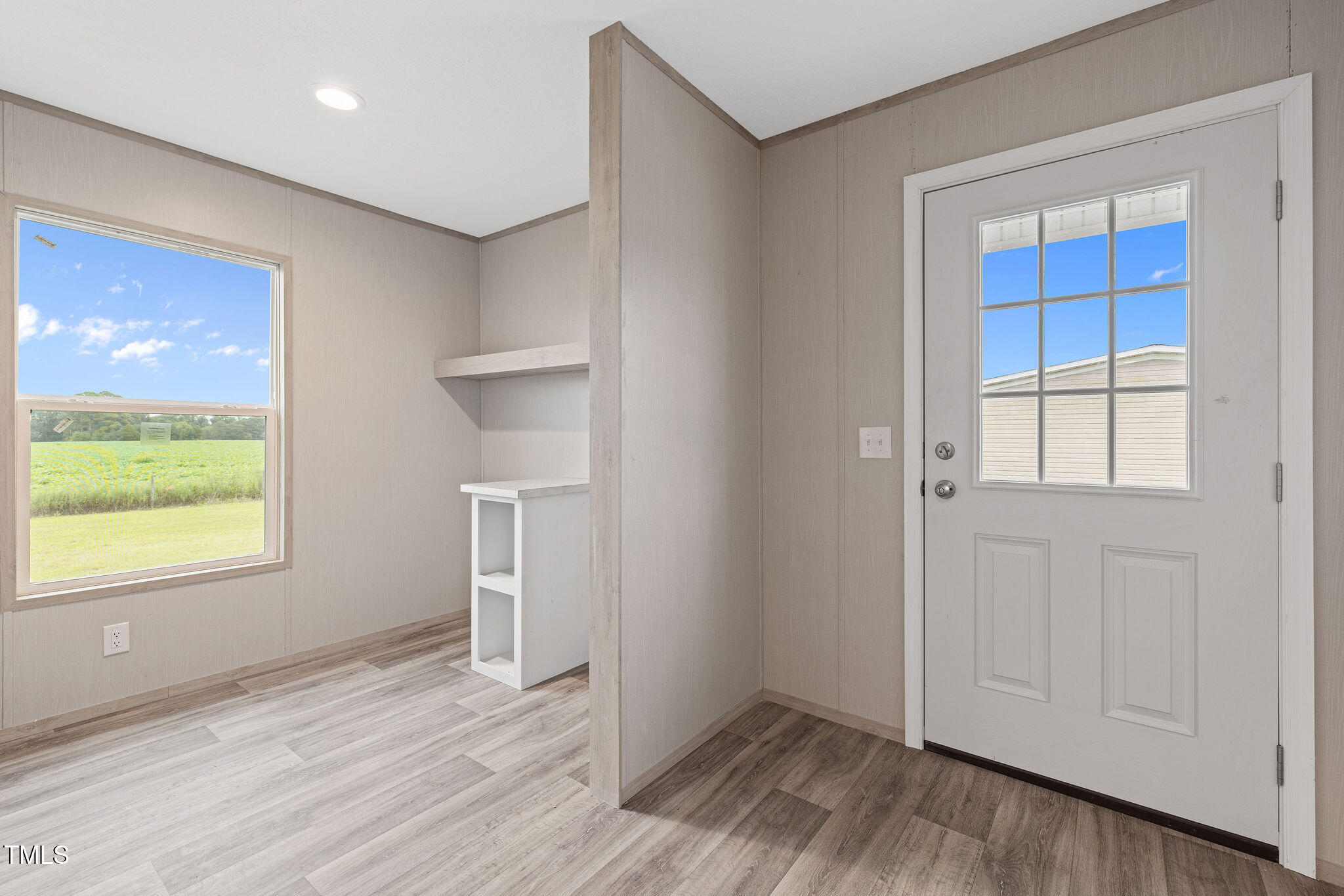 17 Stardust Lane Selma, NC 27576 - Photo 26 of 27 a view of an empty room with wooden floor and a window