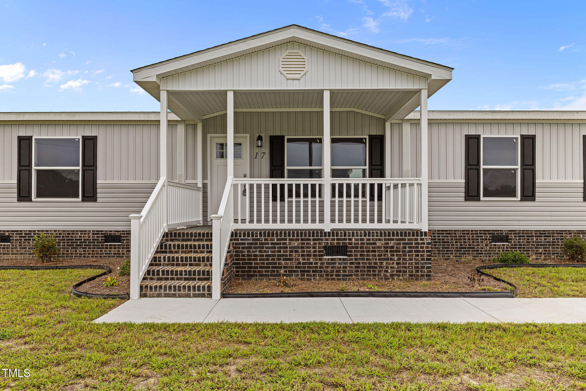 17 Stardust Lane Selma, NC 27576 - Photo 3 of 27 a view of a house with wooden floor and a yard