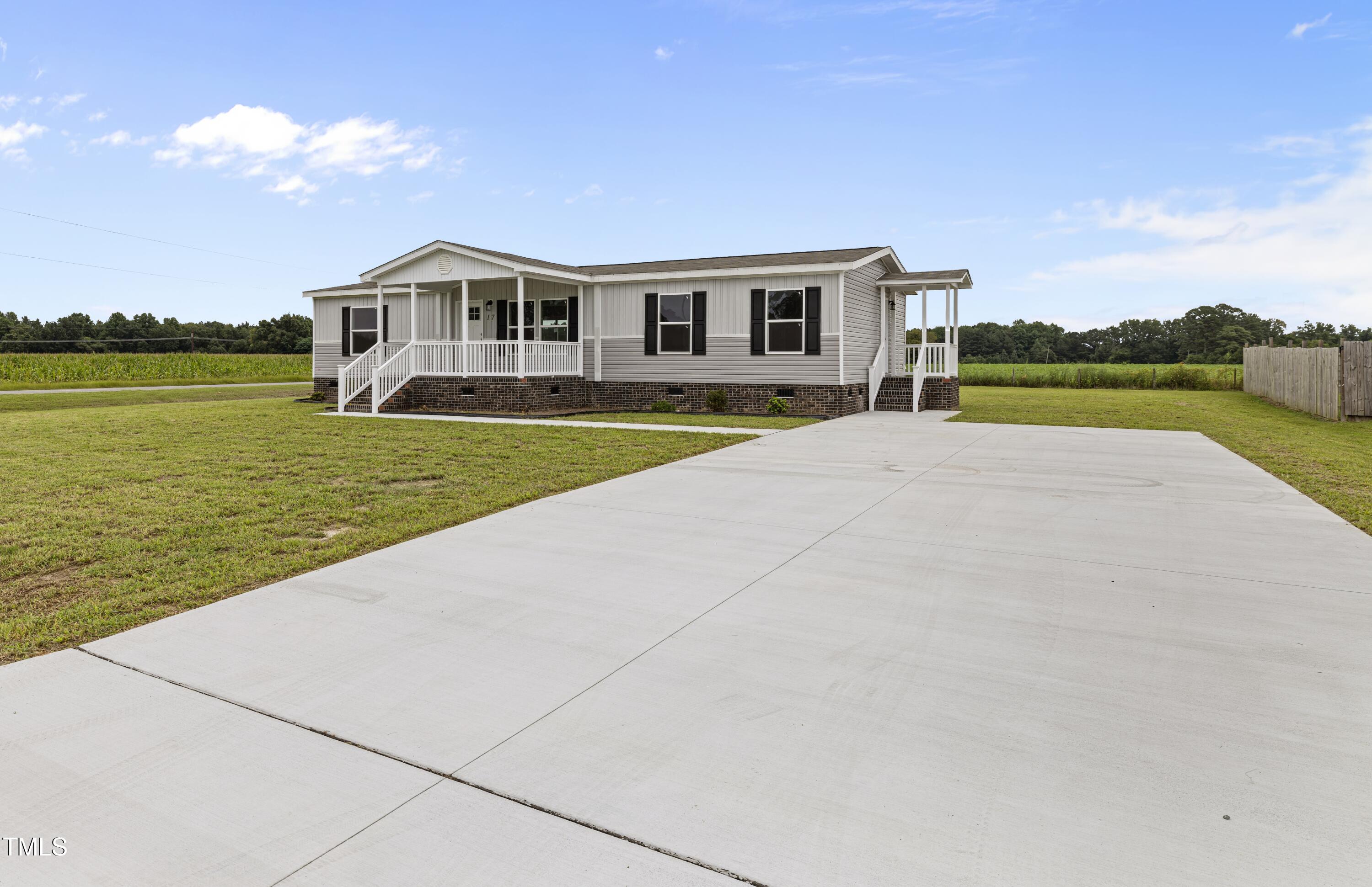 17 Stardust Lane Selma, NC 27576 - Photo 4 of 27 a front view of a house with a yard