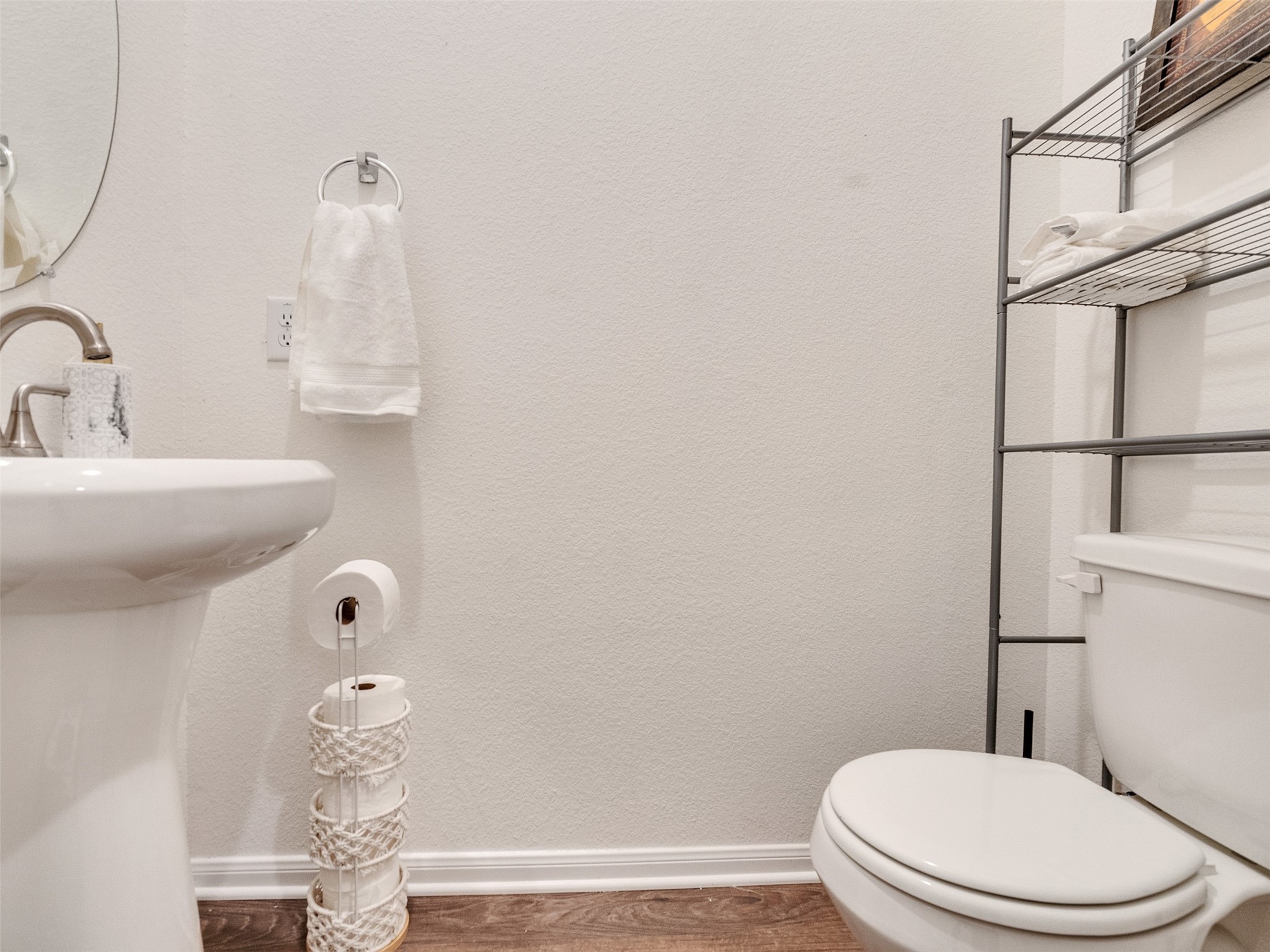 420 Magnolia Lane Richwood, TX 77531 - Photo 26 of 27 a white toilet sitting next to a bathroom sink