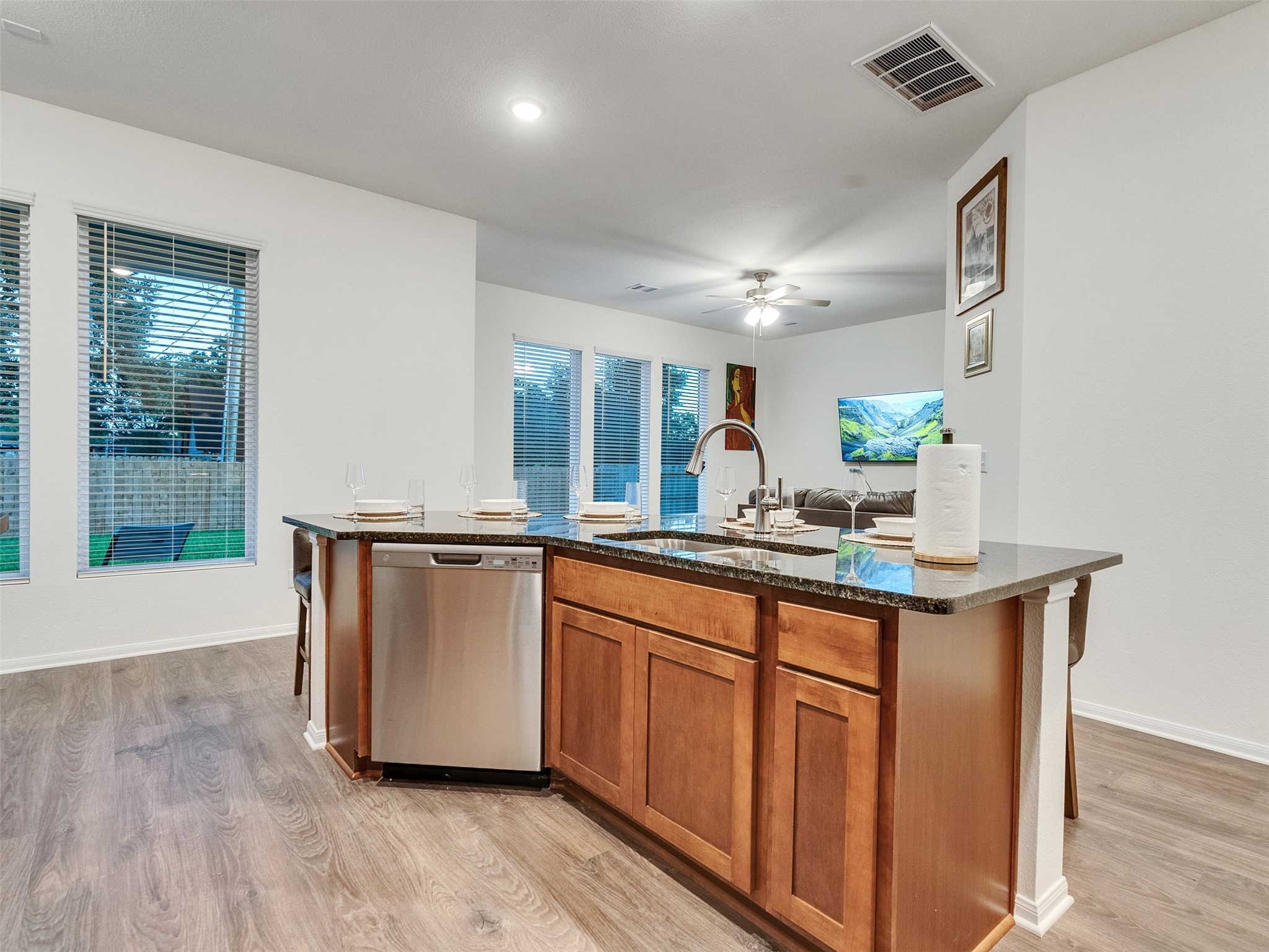 420 Magnolia Lane Richwood, TX 77531 - Photo 6 of 27 a kitchen with granite countertop a sink and cabinets
