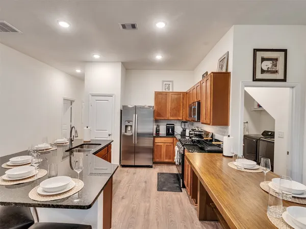 a kitchen with a table and chairs in it