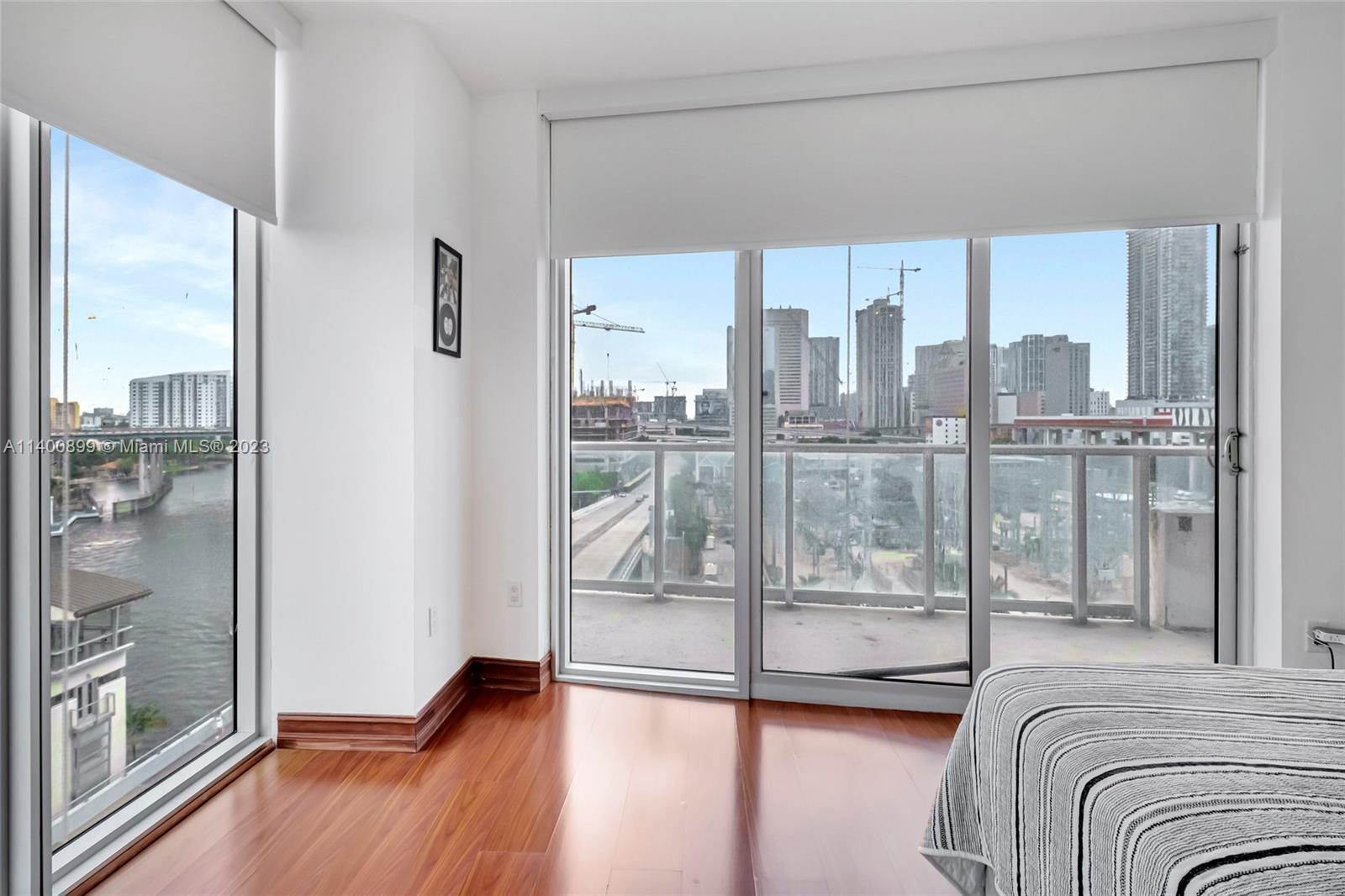 185 Southwest 7th Street, Unit 901 Miami, FL 33130 - Photo 17 of 35 a living room with a glass door