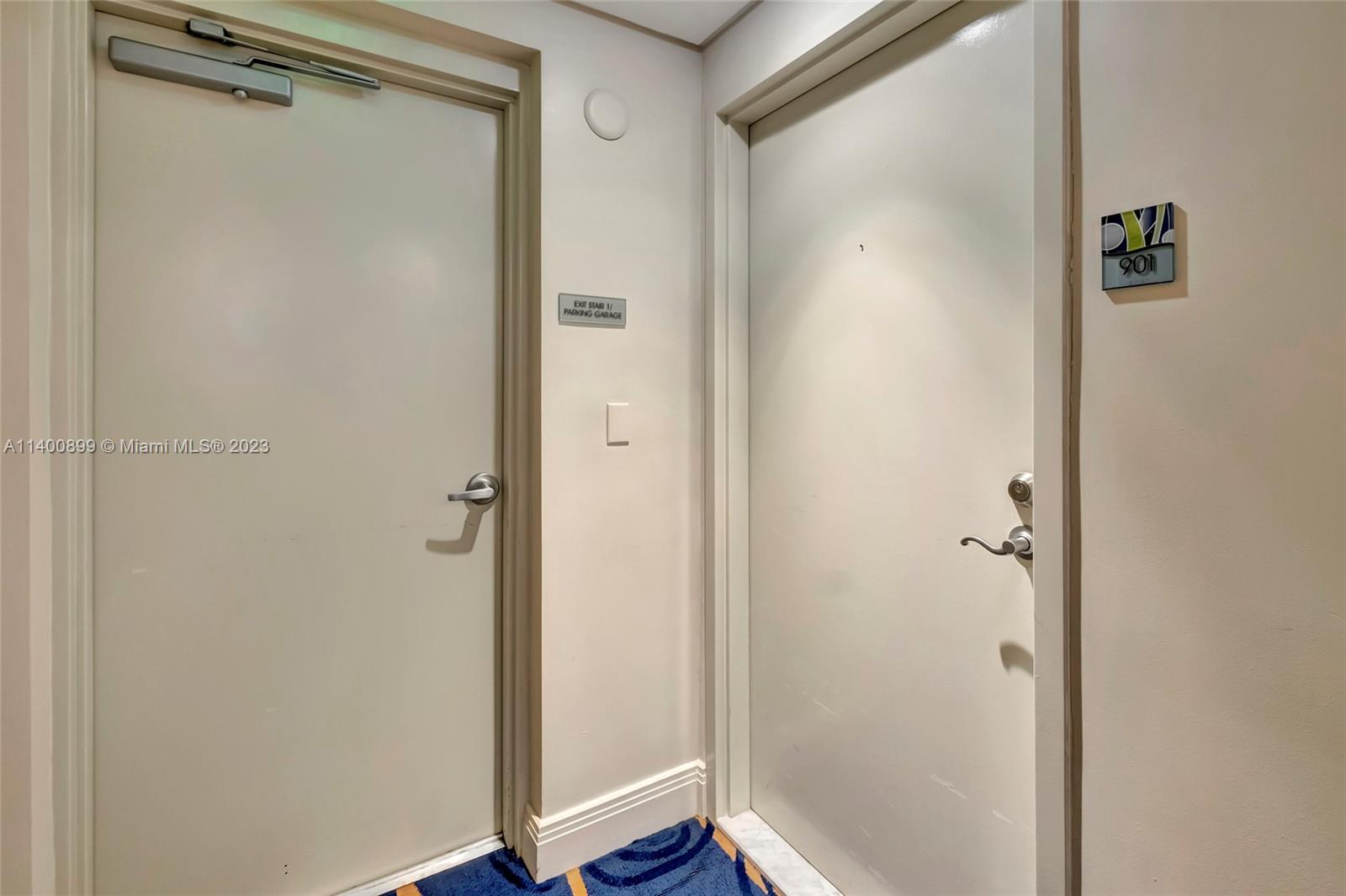 185 Southwest 7th Street, Unit 901 Miami, FL 33130 - Photo 33 of 35 a bathroom with a glass shower door