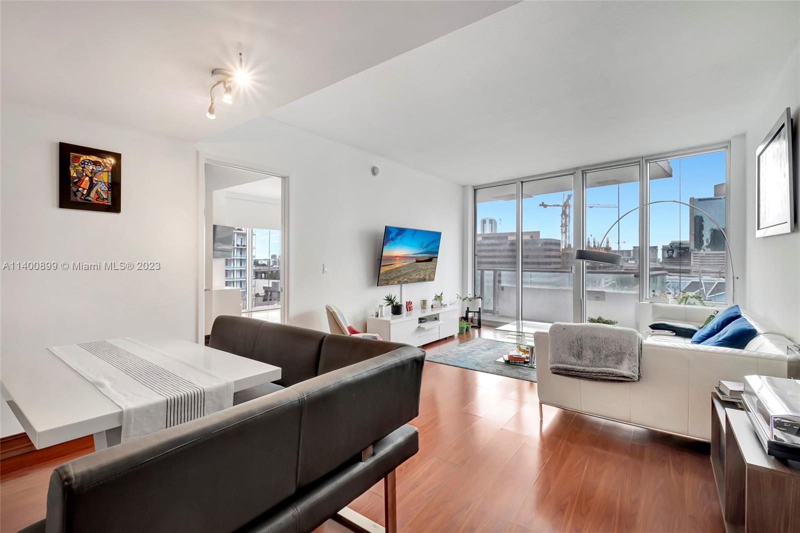 185 Southwest 7th Street, Unit 901 Miami, FL 33130 - Photo 10 of 35 a living room with furniture and a large window