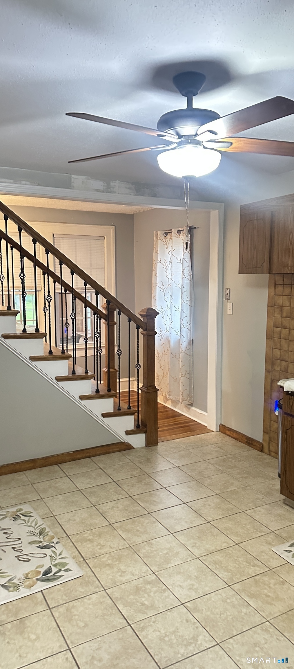 83 Faneuil Street Windsor, CT 06095 - Photo 7 of 14 a view of an empty room with wooden floor and fan