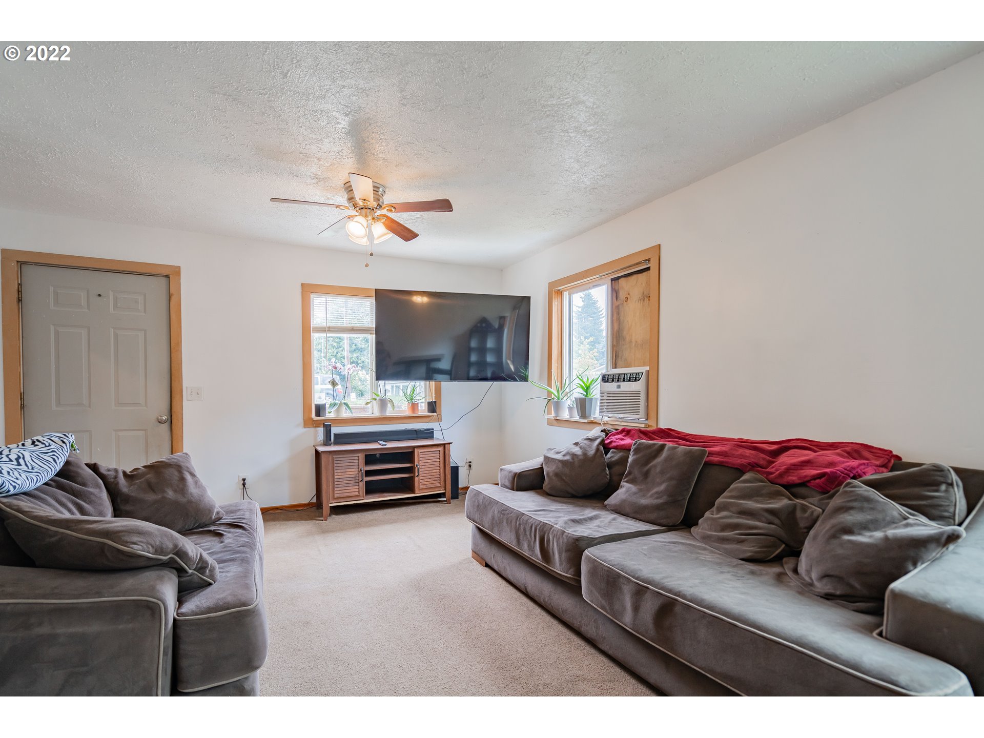 111 South 3rd Avenue Ridgefield, WA 98642 - Photo 11 of 32 a living room with furniture and a flat screen tv