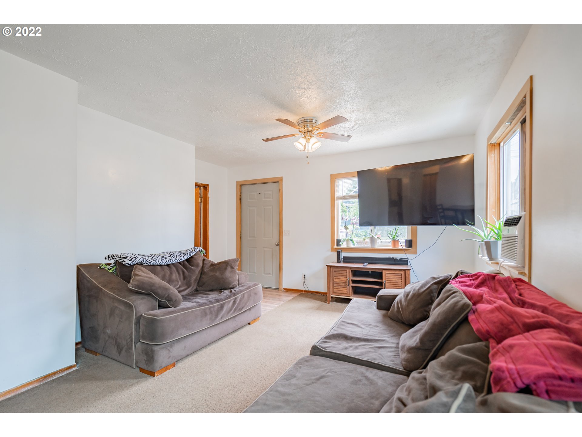 111 South 3rd Avenue Ridgefield, WA 98642 - Photo 12 of 32 a living room with furniture and a flat screen tv