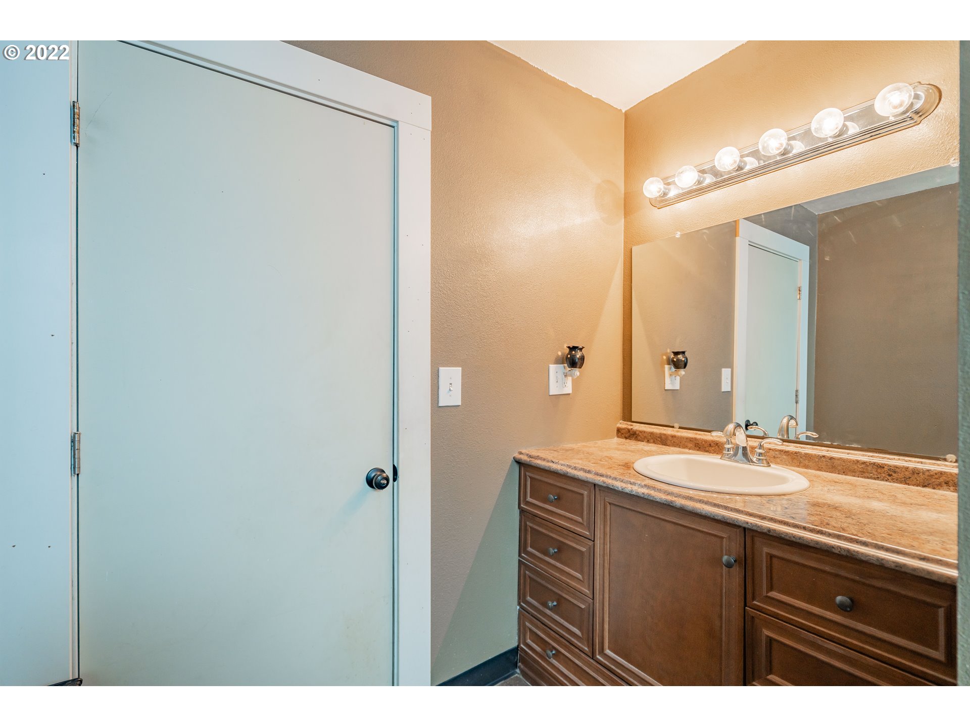 111 South 3rd Avenue Ridgefield, WA 98642 - Photo 19 of 32 a bathroom with a sink and a mirror