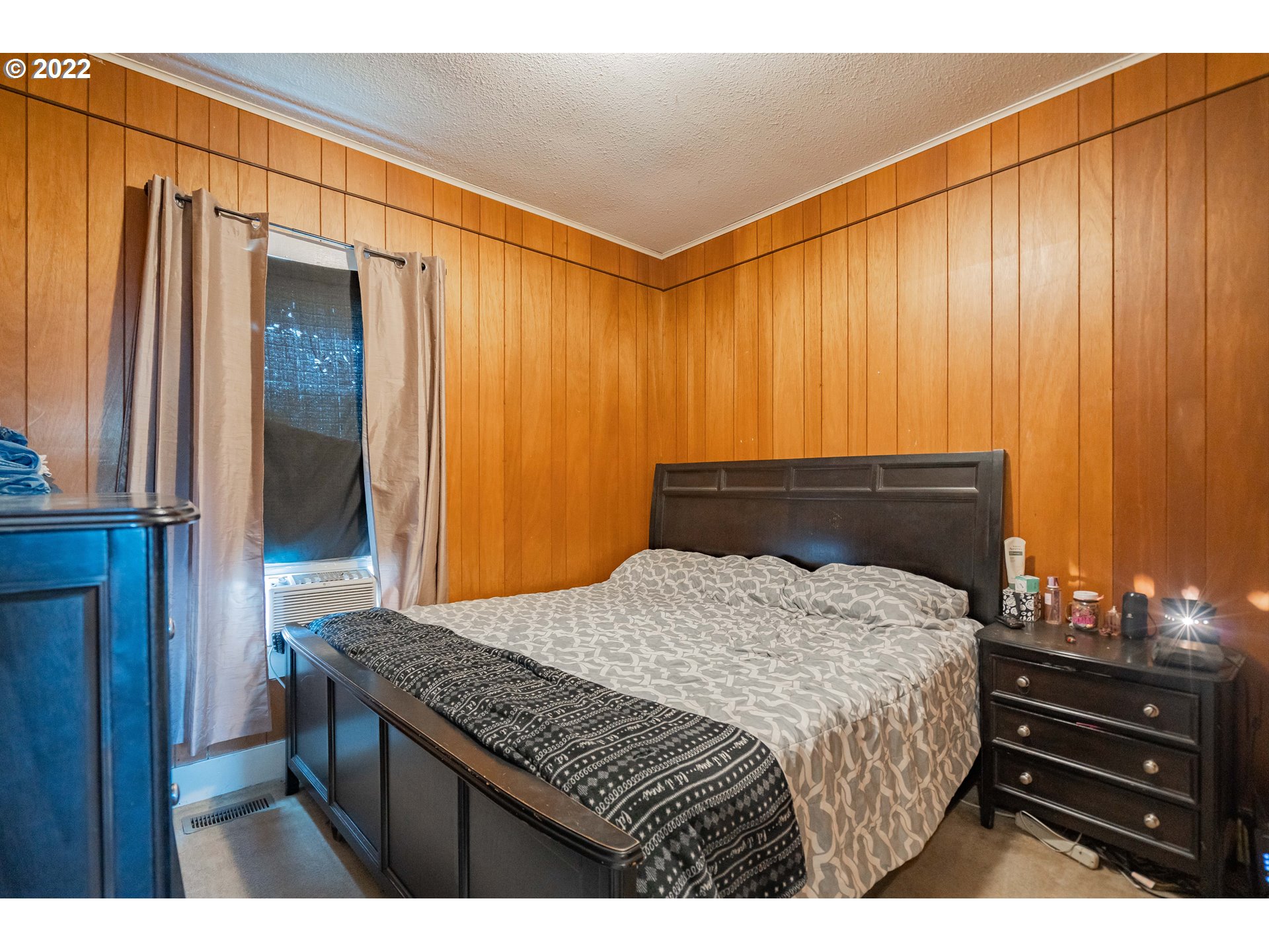 111 South 3rd Avenue Ridgefield, WA 98642 - Photo 20 of 32 a bedroom with a bed and a dresser