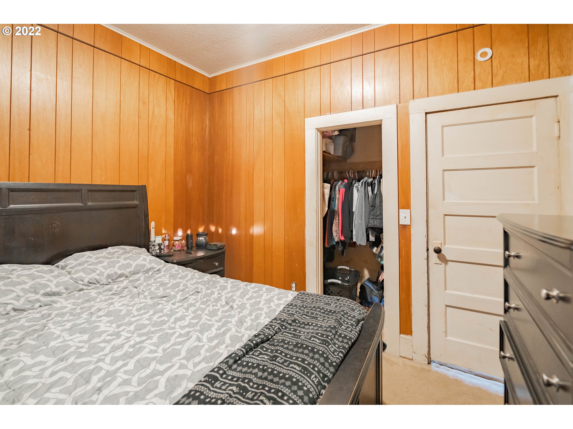 111 South 3rd Avenue Ridgefield, WA 98642 - Photo 22 of 32 a bedroom with a bed and a dresser