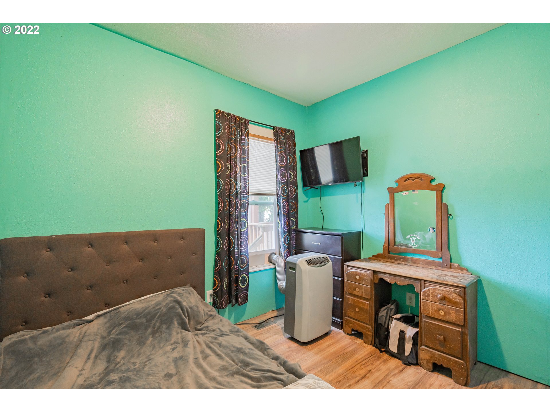 111 South 3rd Avenue Ridgefield, WA 98642 - Photo 24 of 32 a living room with furniture and a flat screen tv