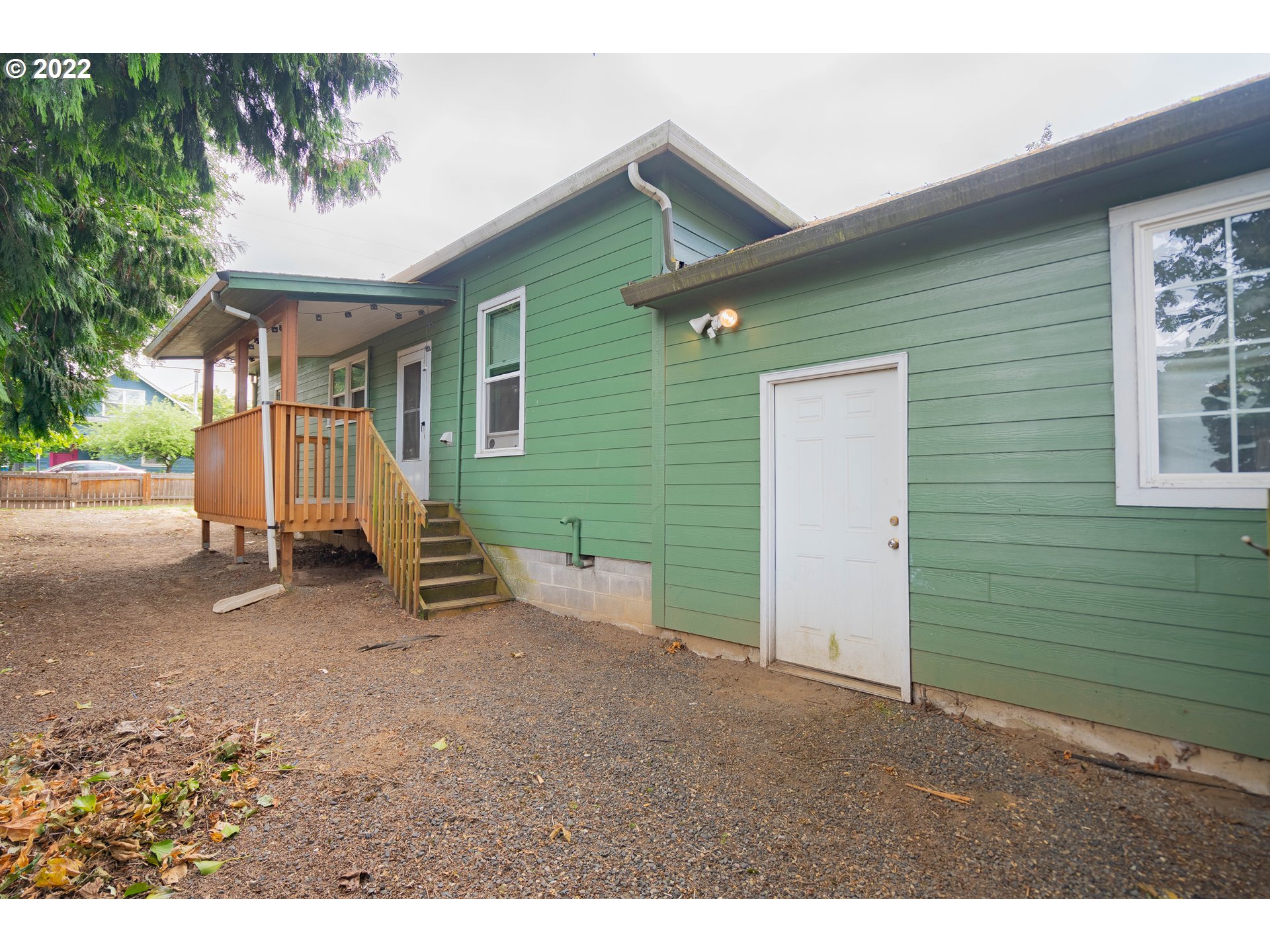 111 South 3rd Avenue Ridgefield, WA 98642 - Photo 28 of 32 a view of a house with a backyard and garage
