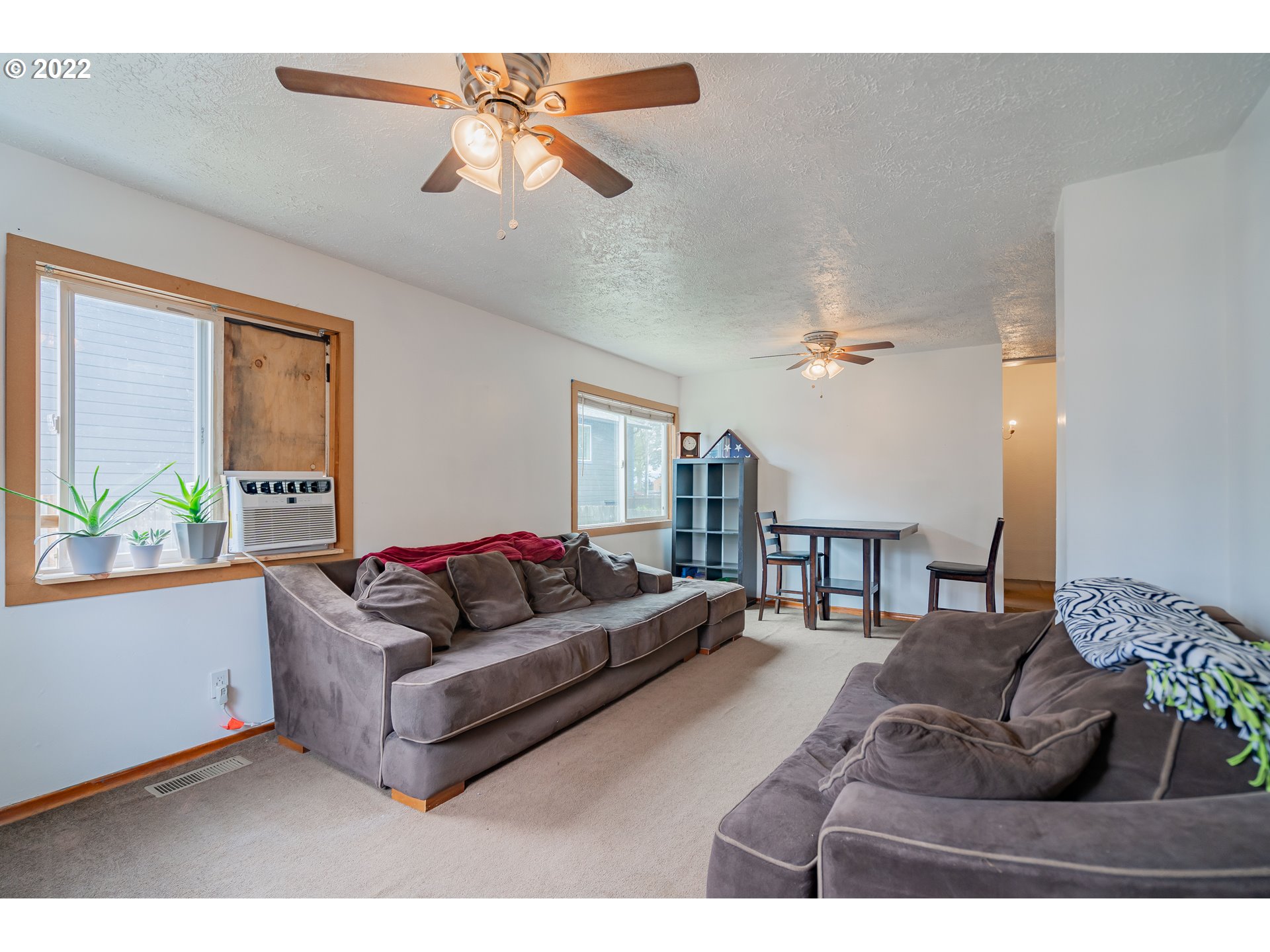 111 South 3rd Avenue Ridgefield, WA 98642 - Photo 8 of 32 a living room with furniture and a large window