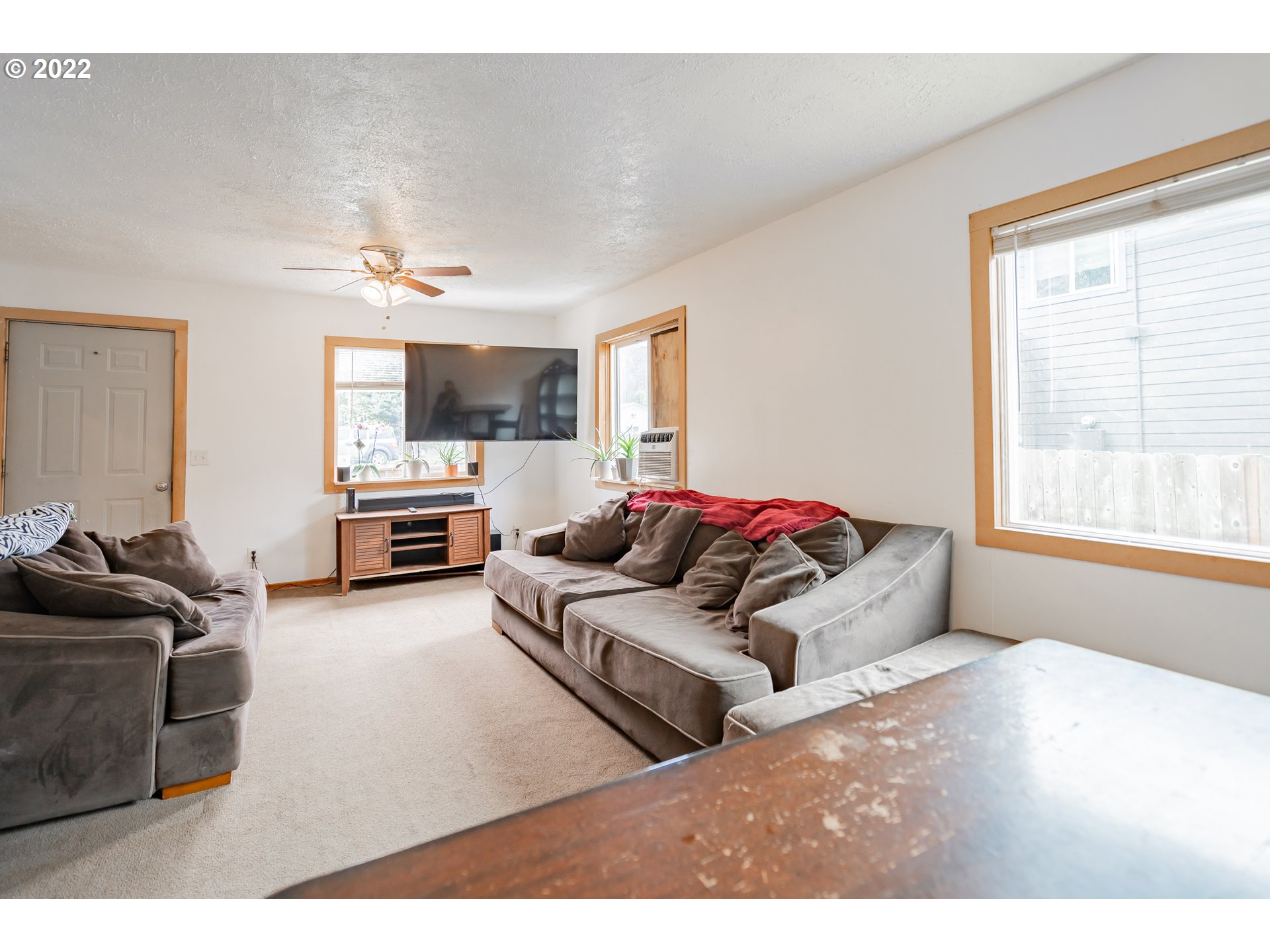 111 South 3rd Avenue Ridgefield, WA 98642 - Photo 10 of 32 a living room with furniture window and a flat screen tv