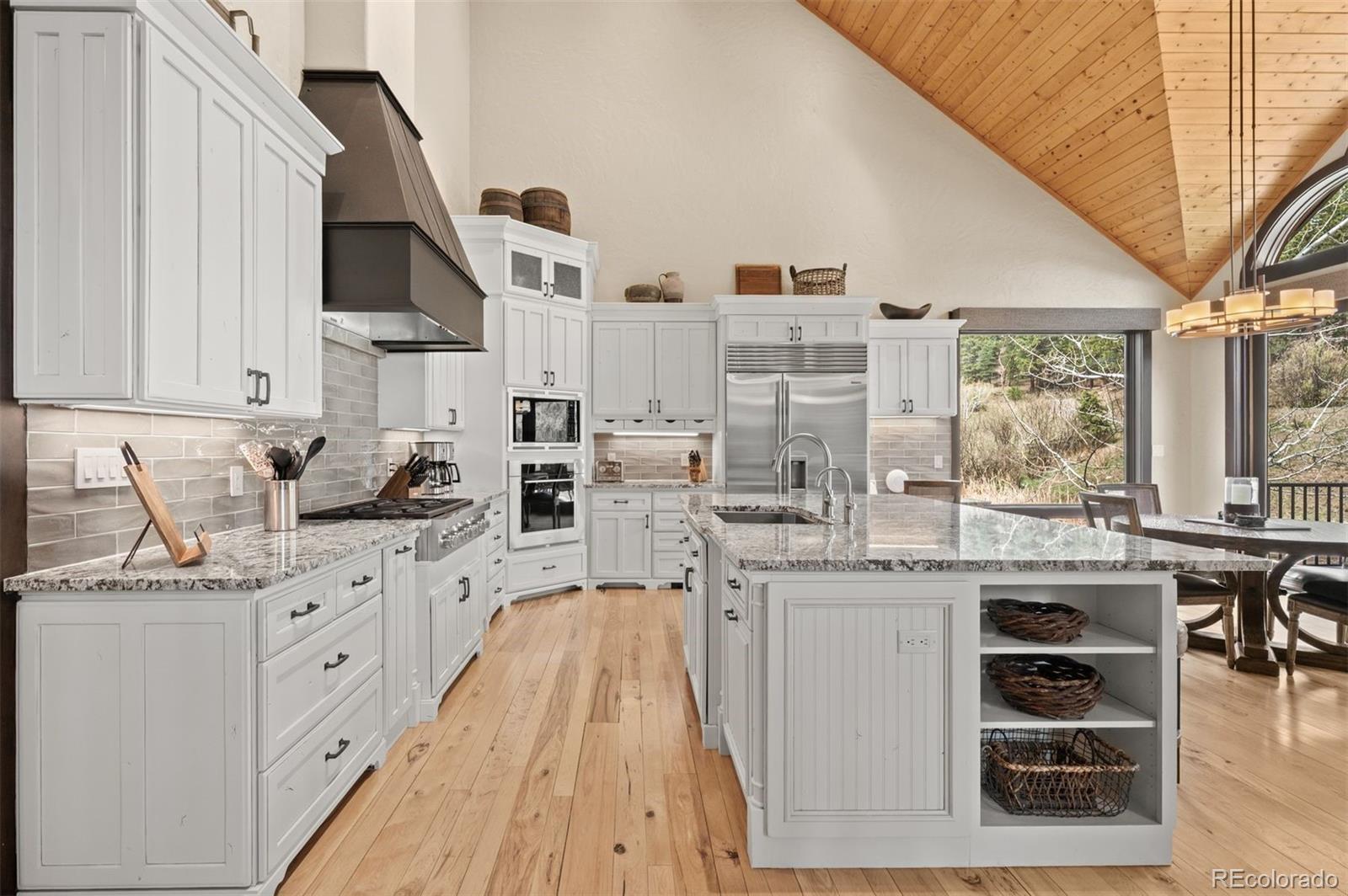 1733 Swede Gulch Road Evergreen, CO 80439 - Photo 19 of 50 a kitchen with cabinets and window